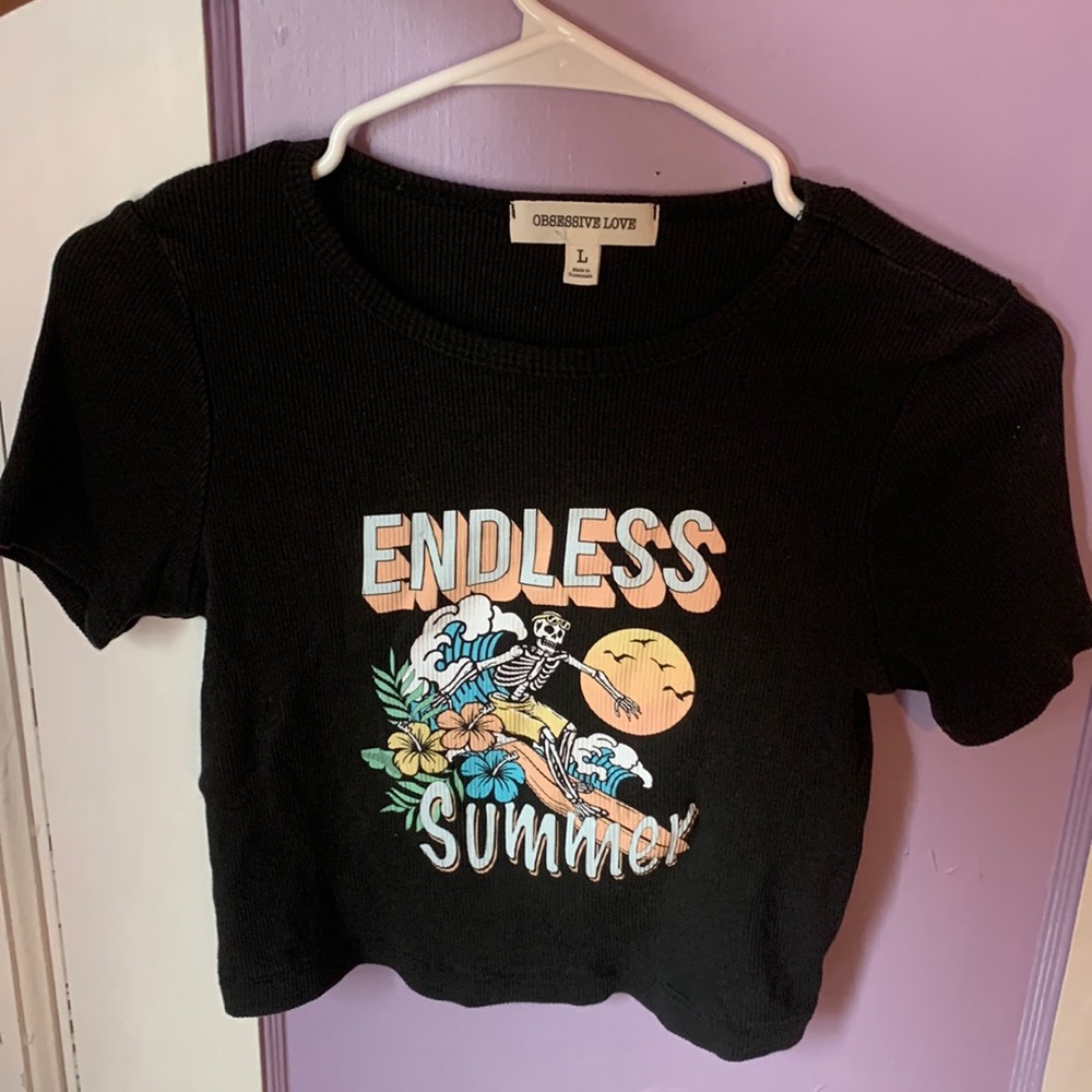 Very cute black crop top size Large by Obsessive Love. Surfing skeleton design.